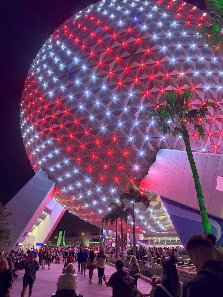 Red and white Candy Cane striped Epcot ball at Christmas time