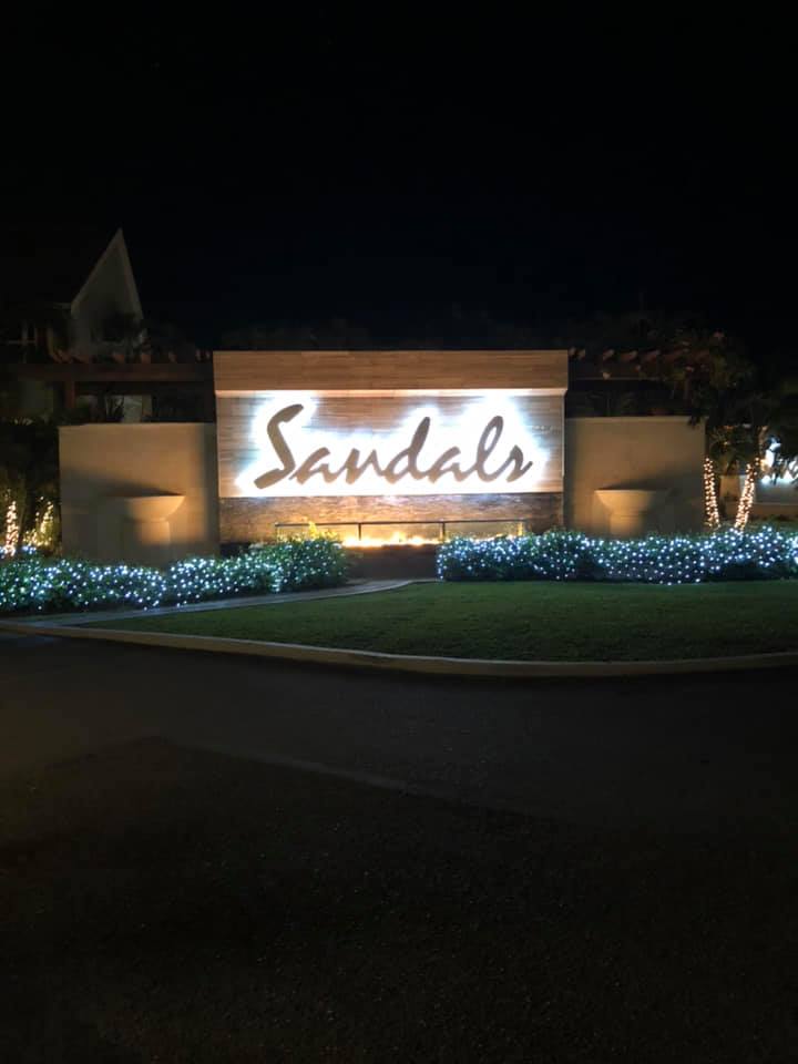 Sandals Ochi sign at night